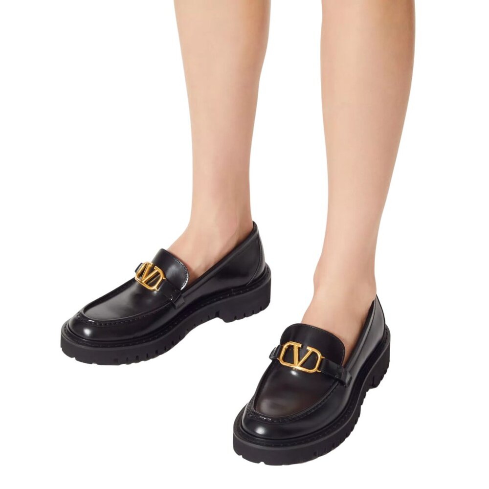 Valentino Garavani Black Leather Lug-Sole Loafers with Gold Buckle